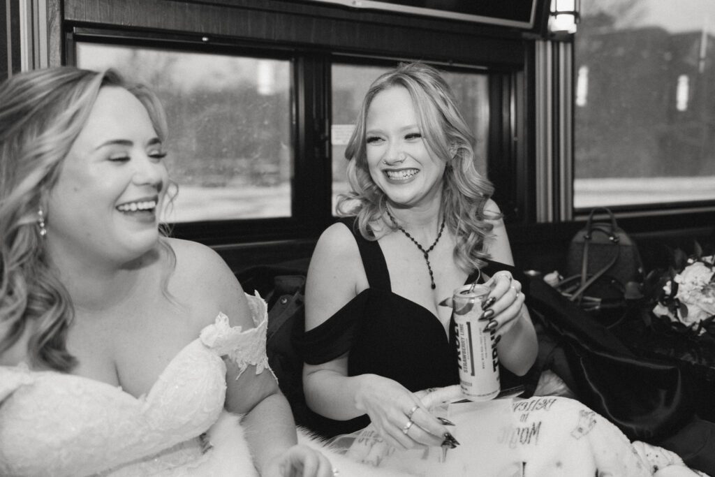 Kirsten and her bridesmaid on their party bus for their Michigan Wedding