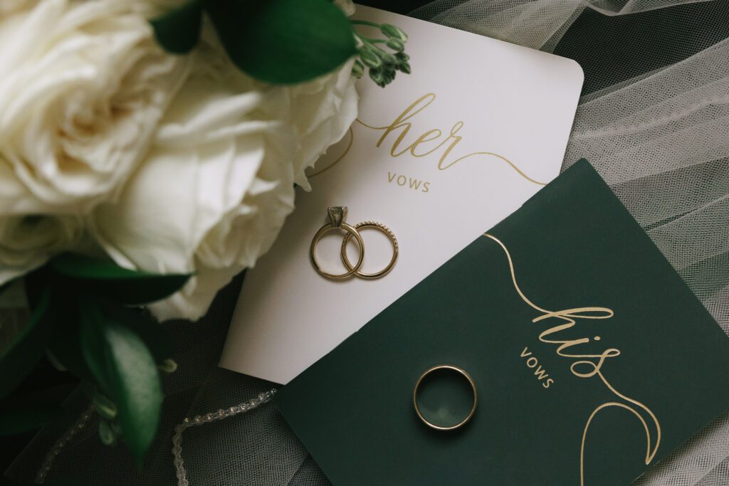 Vow books and rings from Michigan State Wedding