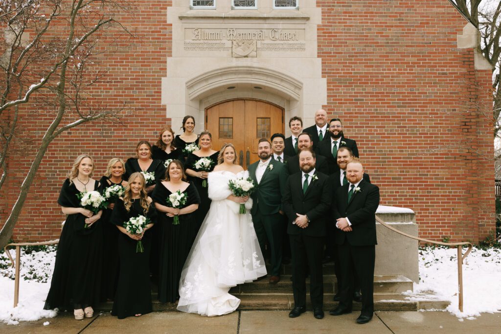 Kirsten and Jeff and their wedding party in front of the Michigan State Alumni Chapel for their Michigan Wedding